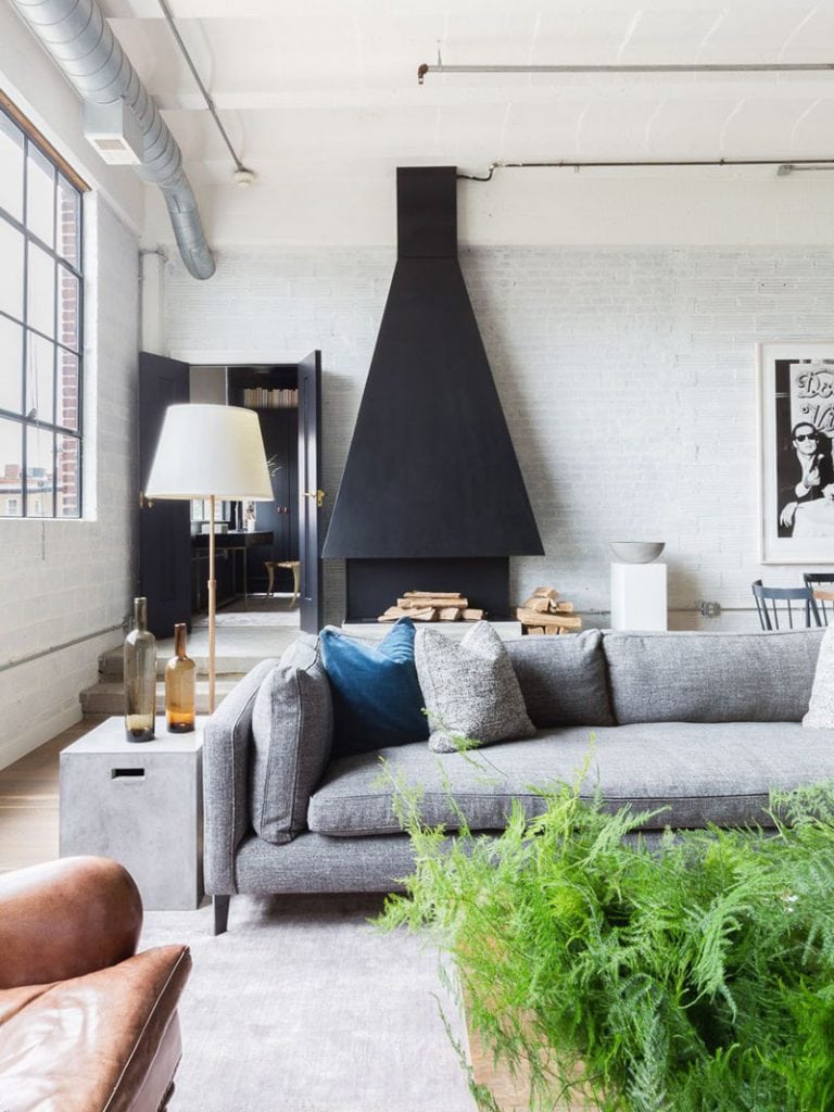 Modern urban loft with custom oversized chimney hood in living room on Thou Swell @thouswellblog 