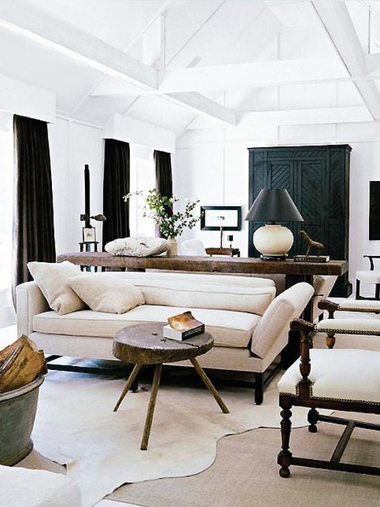 5 Brilliant Ways To Style Cowhide Rugs Thou Swell Darryl Carter Living Room With Layered Cowhide Rug On Thou Swell Thouswellblog